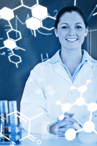 Science graphic against smilling scientist stanting in front of a blackboard photo