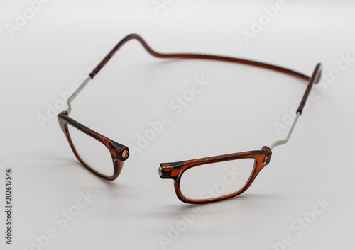 A transparent brown plastic eye-wear or eye-glasses isolated on the white