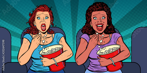 Two women react differently to the movie. laughs and fears