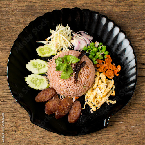 Kao Klook Ga-pi (Rice Mixed with Shrimp paste) on old wood photo