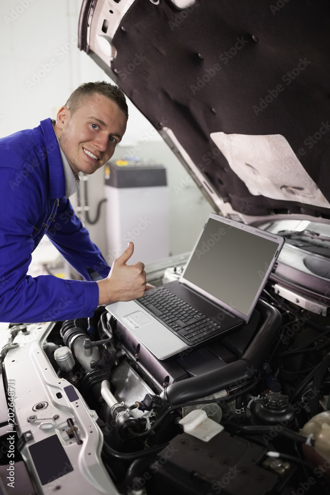 Mechanic working on a computer Mechanic working on a computer