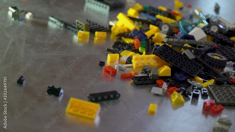 Colorful plastic designer at the table, building kit Colorful plastic designer at the table, building kit