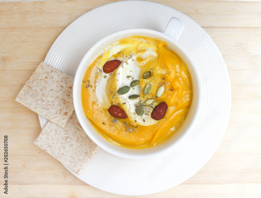 pumpkin soup with almond and pumpkin seed and whipping cream pumpkin soup with almond and pumpkin seed and whipping cream