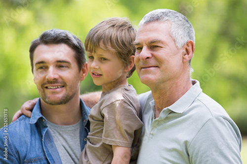 Grandfather father and son smiling at park © WavebreakmediaMicro