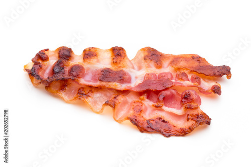 Cooked bacon rashers isolated on white.