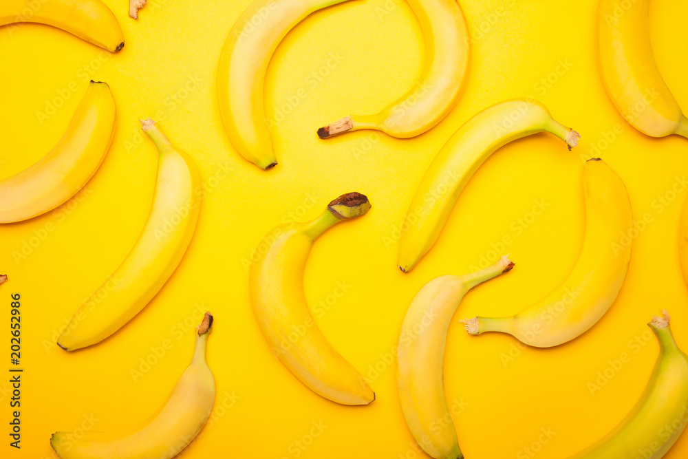 Bananas on yellow background Bananas on yellow background