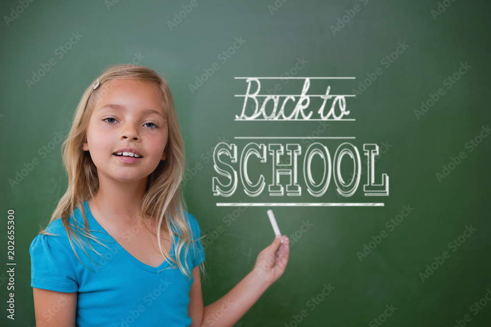 Composite image of back to school message against cute pupil holding chalk