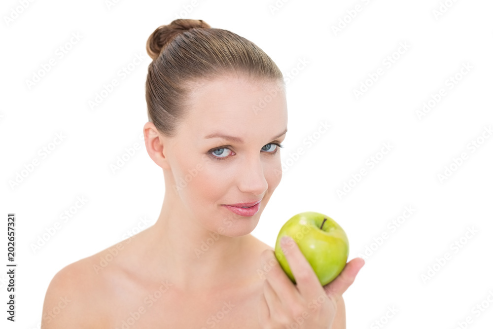 Natural pretty blonde model holding an apple Natural pretty blonde model holding an apple