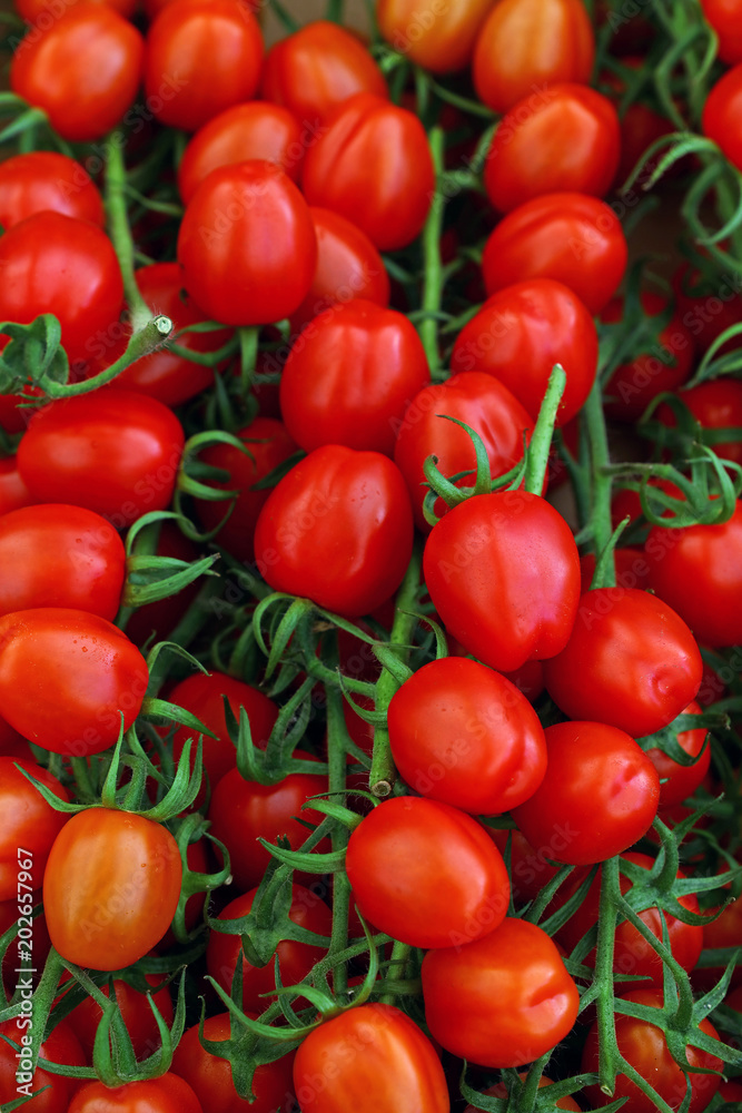 Close up fresh red cherry tomatoes in retail Close up fresh red cherry tomatoes in retail