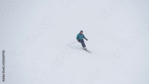 One person skiing on a ski slope 