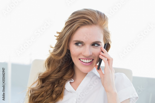 Businesswoman using cellphone in office