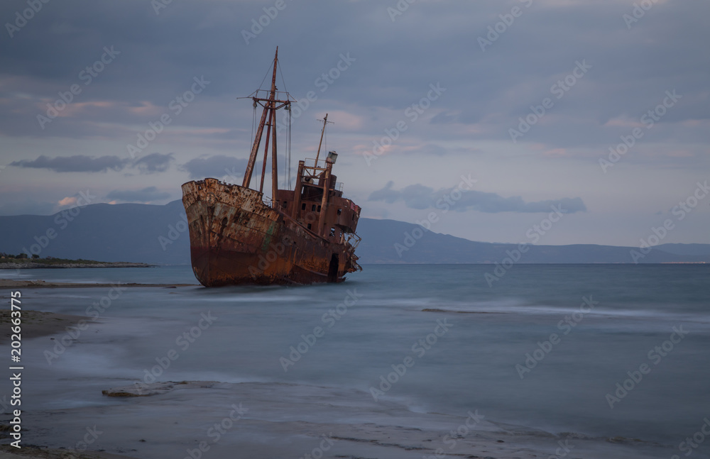 The famous rusty shipwreck near Gytheio at sunset