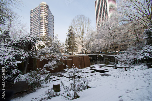 Keller Fountan park in Portland, Oregon covered in snow, with footprints throughout. photo