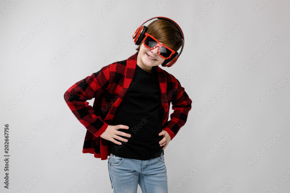 Teenage boy in fashionable clother and headphones