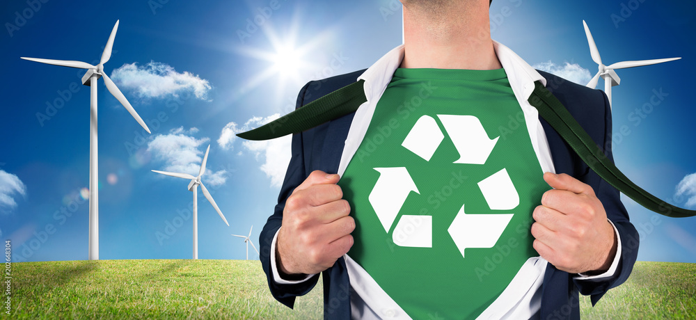 Φωτογραφία Businessman opening shirt in superhero style against digital landscape with thre