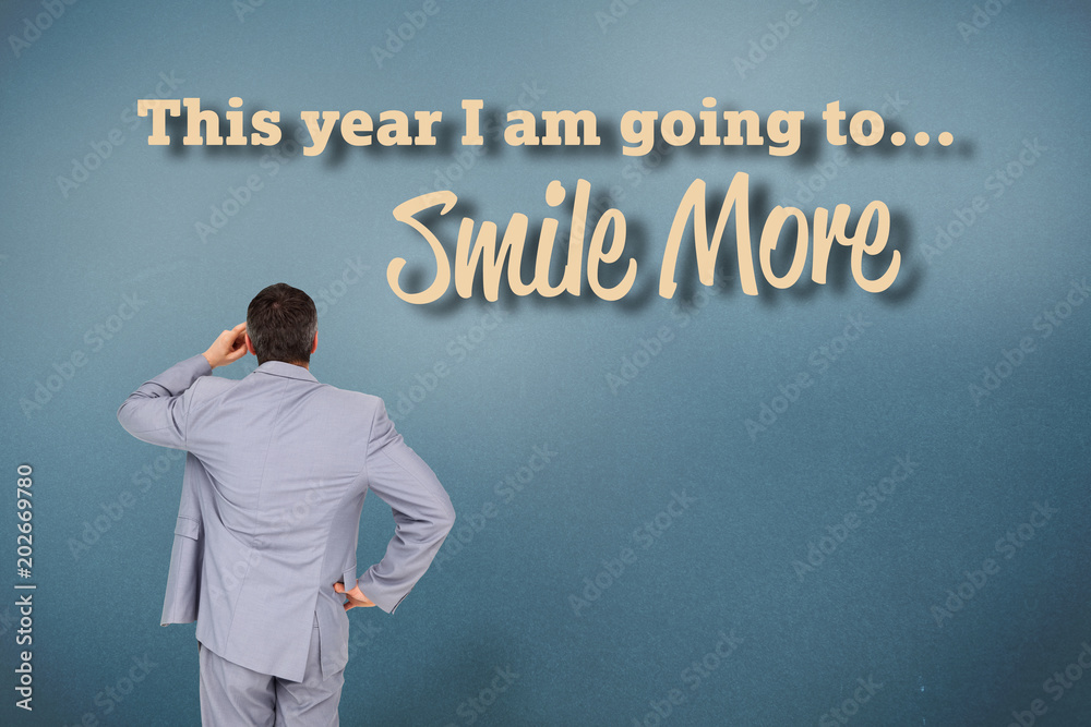 Thinking businessman against grey vignette Thinking businessman against grey vignette