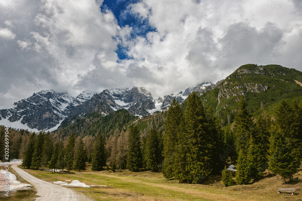 Snow on the peaks with dramatic sky in Austrian Alps