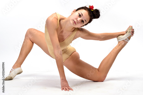 Young girl gymnast on white background (isolation on white)