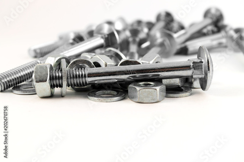 Prefabricated metal screw for fastening on the background of bolts, nuts and washers.