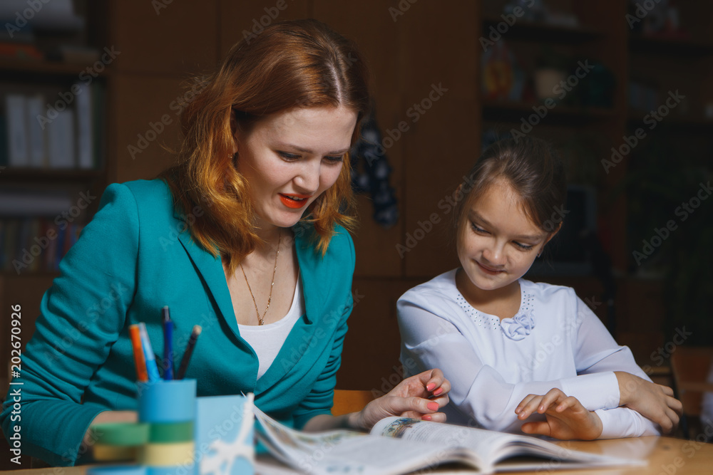 mother embracing daughter depressed about math homework mother embracing daughter depressed about math homework