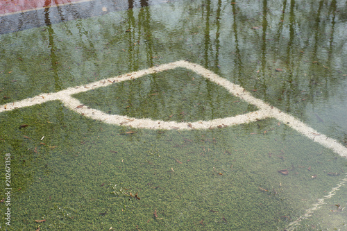 A flooded soccer field after heavy rain photo