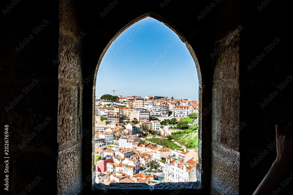 Fototapeta premium Old Lisbon Portugal panorama. cityscape with roofs. Tagus river. miraduro viewpoint. View from sao jorge castle