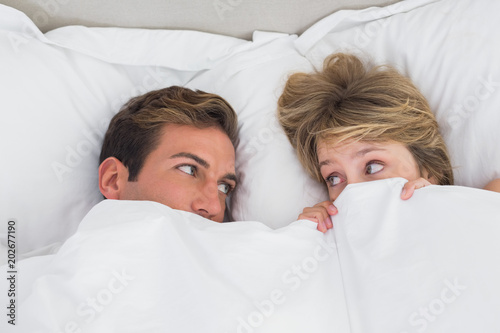 Relaxed young couple in bed