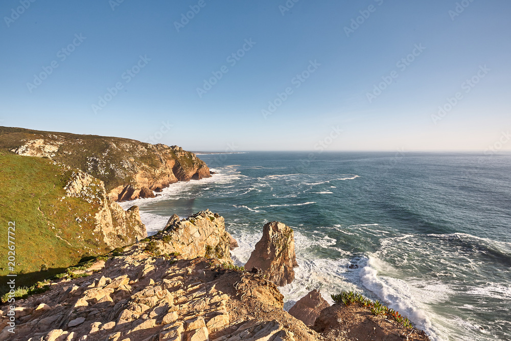 Exploring Portugal. Cabo da Roca ocean and mountains view landscape, authentic capture, wanderlust concept.