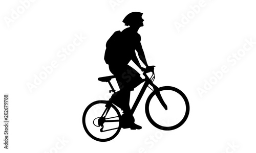 vector boy riding a mountain bike as the road uphill.