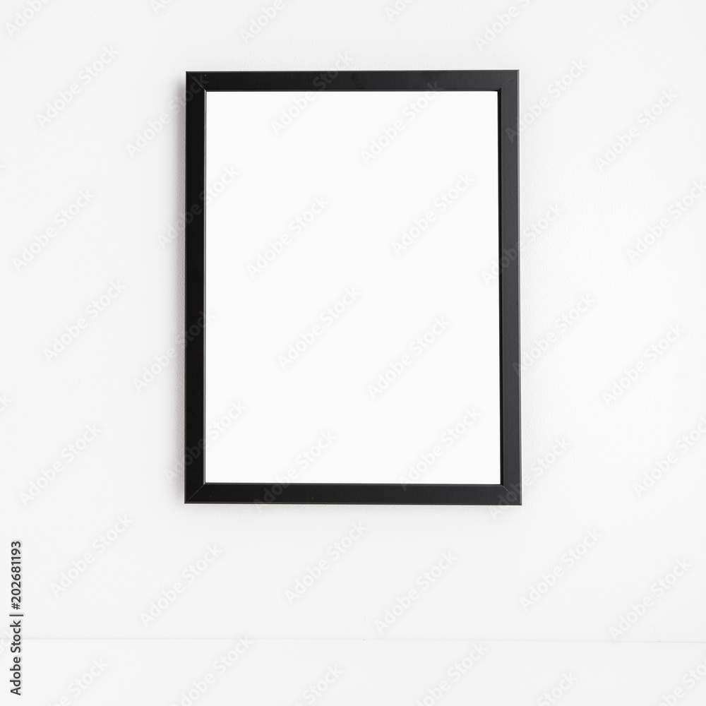 Photo frame on a white wall. Minimal mock up.