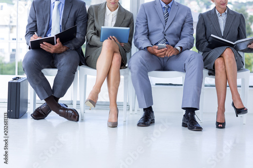 Business people waiting to be called into interview © WavebreakmediaMicro