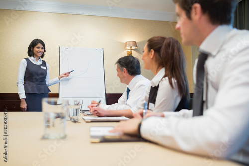 Happy businesswoman giving presentation