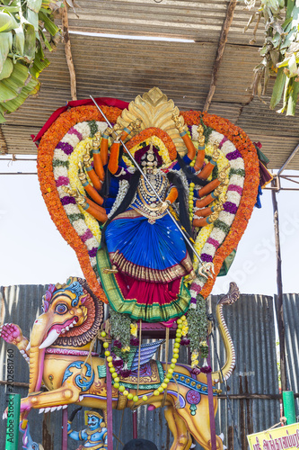 Statues of the Indian gods. Brahma, Vishnu Durga Shiva Ganesha, made with flowers for the the Masi Magam festival. photo