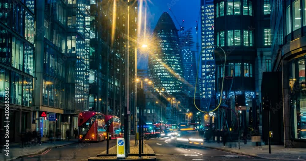 Timelapse view of a busy crossroad at a traffic light in the hearth of the financial district of the City of London