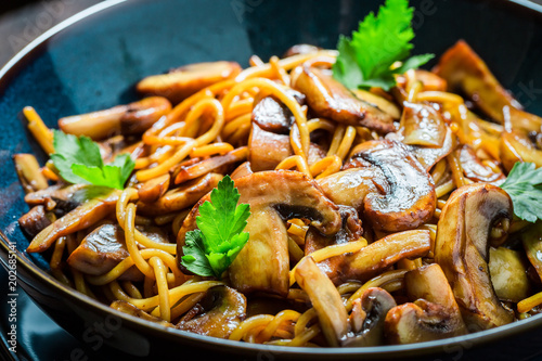 Closeup of creamy spaghetti with mushrooms and parsley