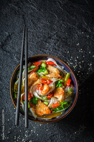 Hot noodle in dark bowl wit...