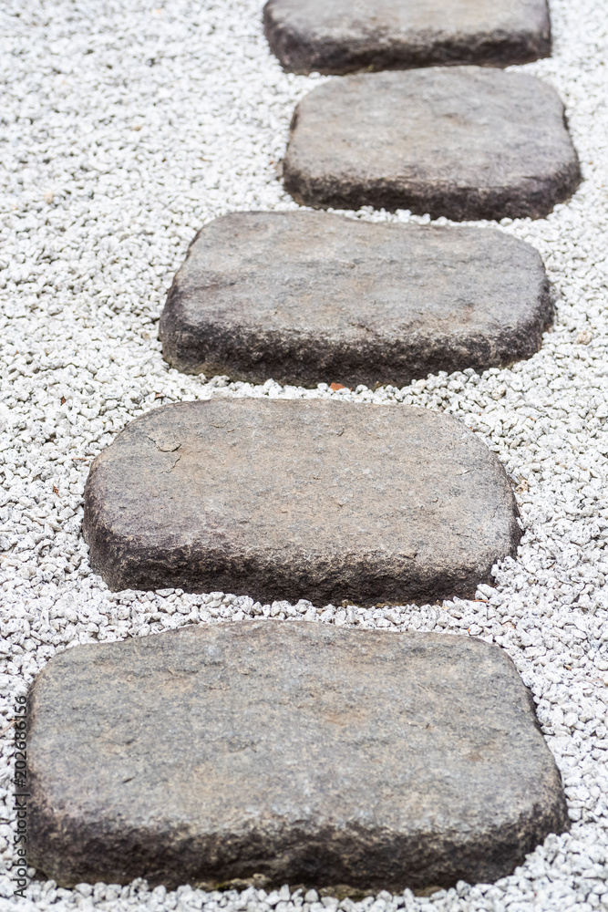 Stone Path of plated stones on gravel bed in Japanese Garden Stone Path of plated stones on gravel bed in Japanese Garden