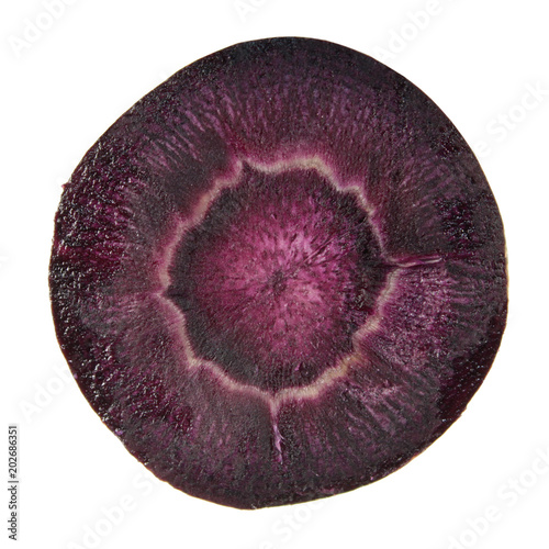 Raw purple carrot cut in half inside cross section isolated on white background