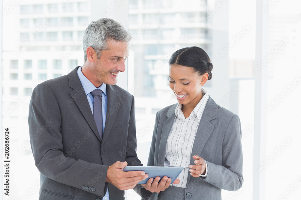Business people using tablet computer Business people using tablet computer
