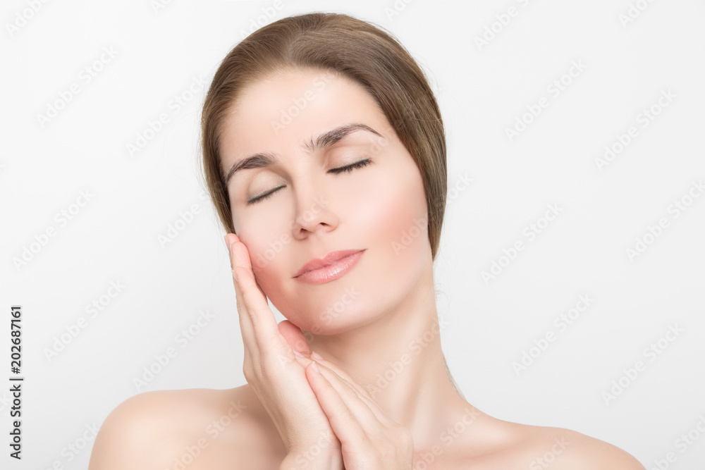 Beautiful sensual woman with closed eyes and hands on her face Beautiful sensual woman with closed eyes and hands on her face