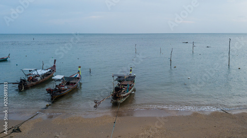 Fishing boat parked on the sea shore