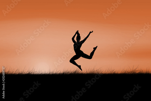 Fit brunette jumping and posing against sun rising