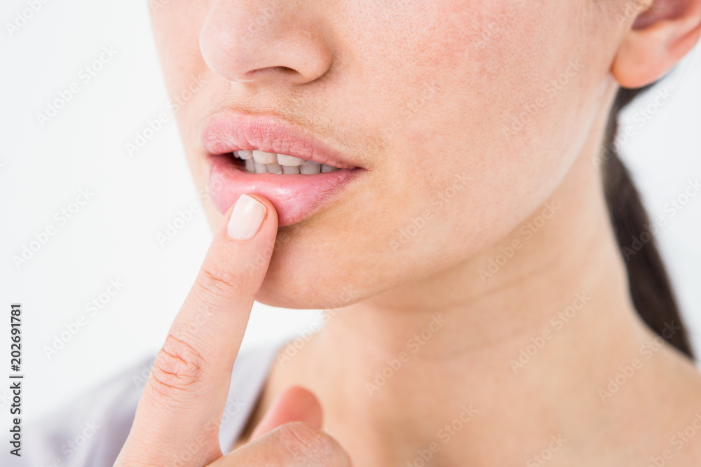 Obraz premium Woman pointing her lip
