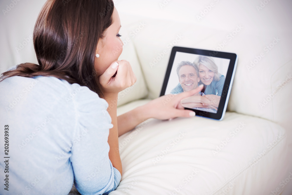 Composite image of couple smiling at the camera Composite image of couple smiling at the camera