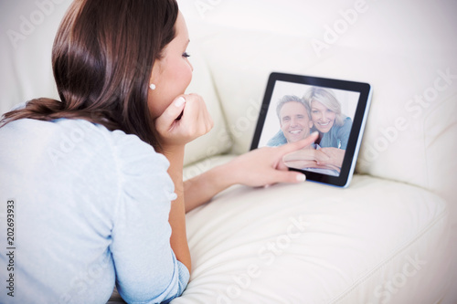 Composite image of couple smiling at the camera