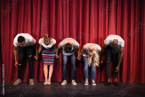 Actors bowing on the stage