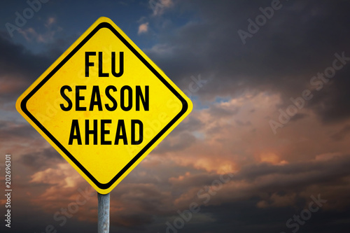 flu season ahead against blue and orange sky with clouds