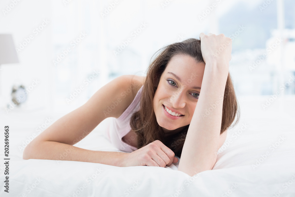 Close up portrait of pretty happy woman resting in bed Close up portrait of pretty happy woman resting in bed