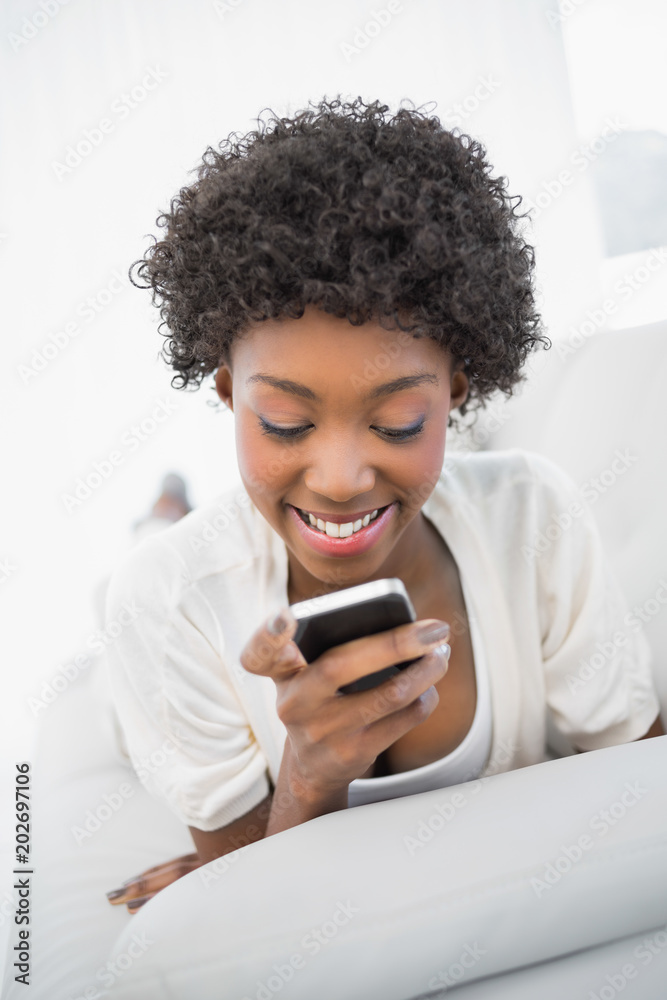 Smiling gorgeous brunette texting Smiling gorgeous brunette texting