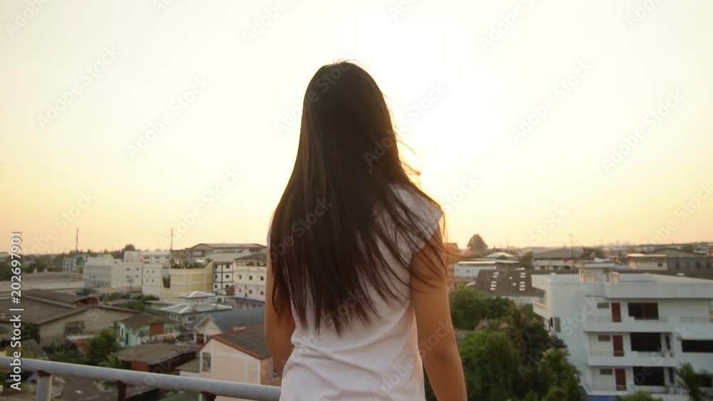 Woman watching on sunset over city, Part1
Woman watching on sunset over city, Part1